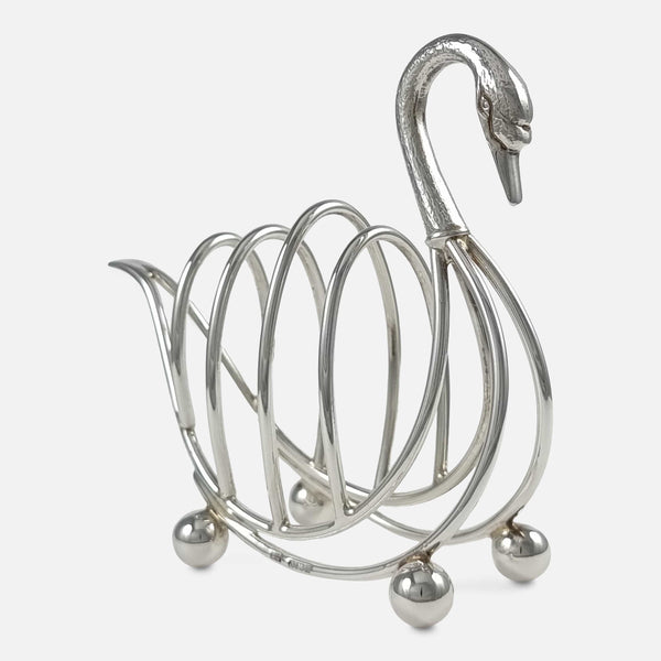 the toast rack with swan head slightly more to the forefront facing towards the right