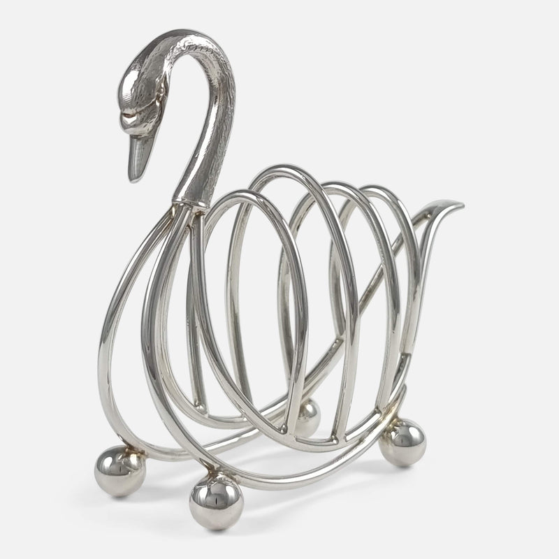 the toast rack with swan head slightly more to the forefront facing towards the left