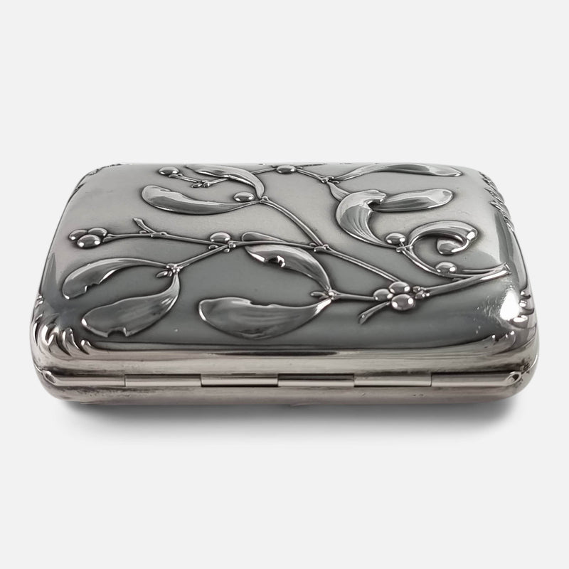 a side on view of the cigarette case with hinge to forefront