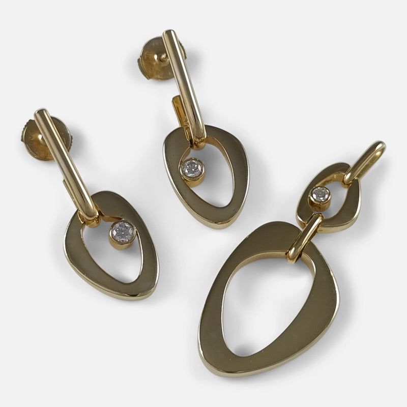the Georg Jensen 18ct gold diamond pendant and earring set designed by Lina Falkesgaard, viewed from above