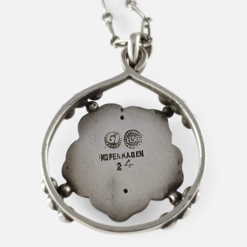 the silver pendant viewed from the back