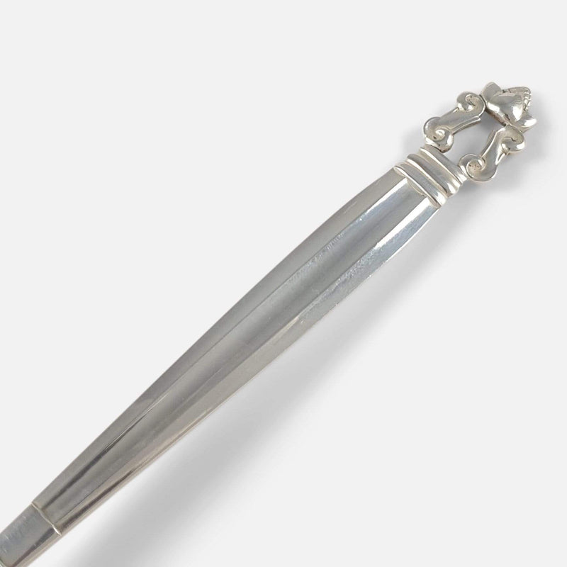 focused on the handle and acorn finial