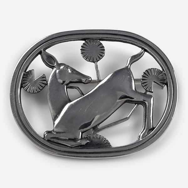 A Georg Jensen silver kneeling fawn brooch, designed by Arno Malinowski, viewed from above