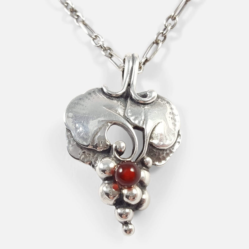 the Georg Jensen silver pendant in focus