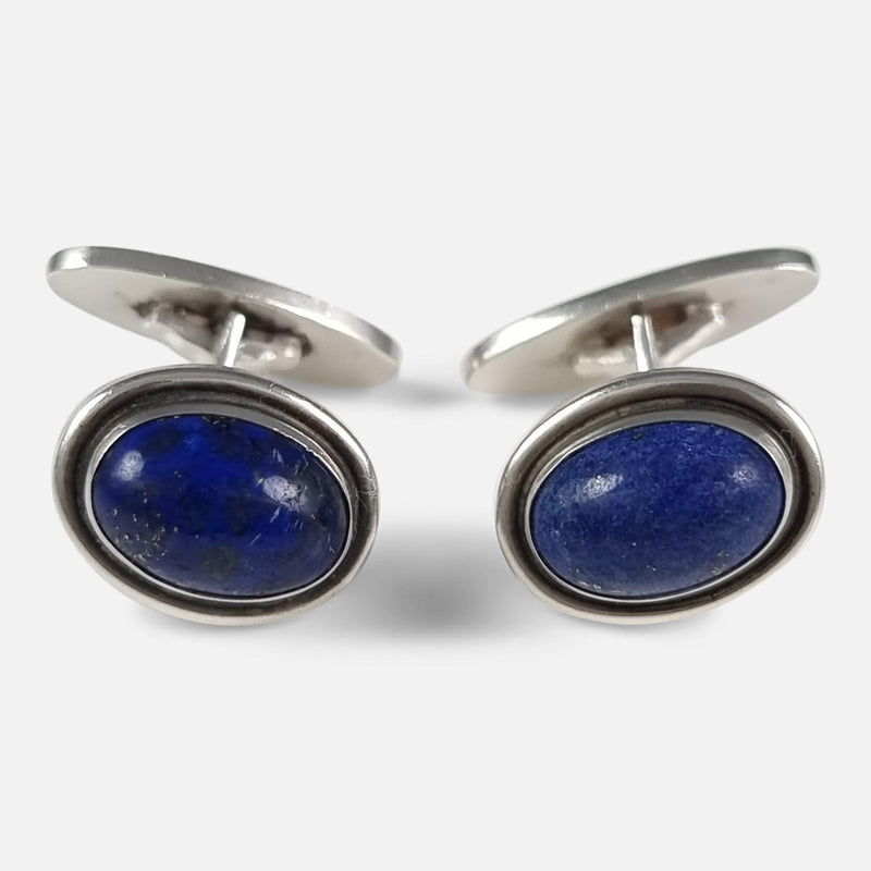 the pair of Georg Jensen silver and lapis lazuli cabochon cufflinks viewed face on