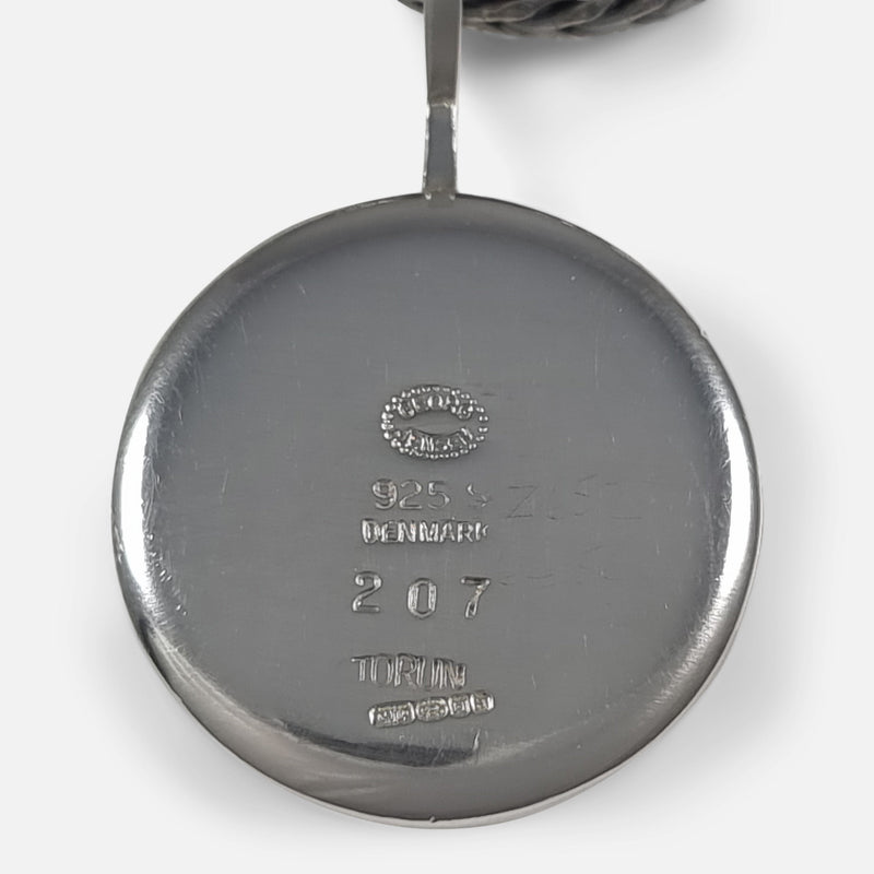 focused on the makers marks and hallmarks to the back of the pendant