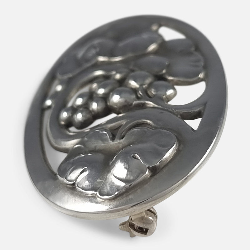 a side on view of the silver brooch