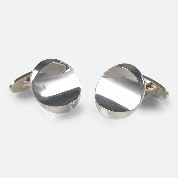 the pair of Georg Jensen sterling silver cufflinks viewed with face to the forefront