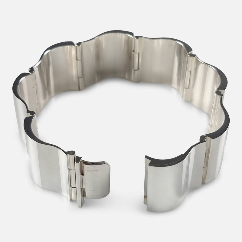 the silver bracelet with clasp unfastened
