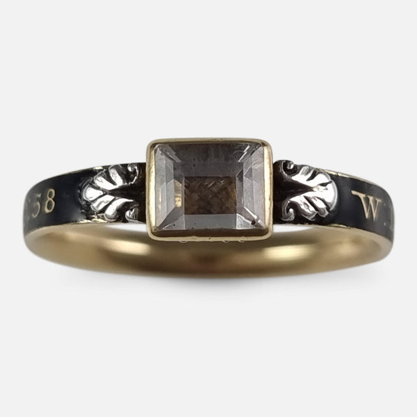the George I 18ct gold rock crystal, hair-work, and enamel mourning ring viewed from the front