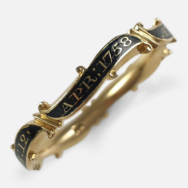 the George II gold and enamel mourning ring viewed diagonally from above
