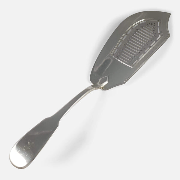 the George III silver fish slice viewed diagonally