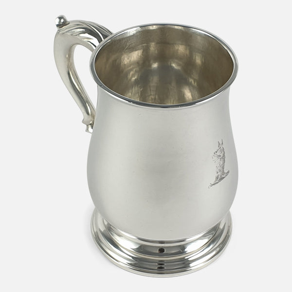 the mug viewed at a slight angle with engraved crest in view