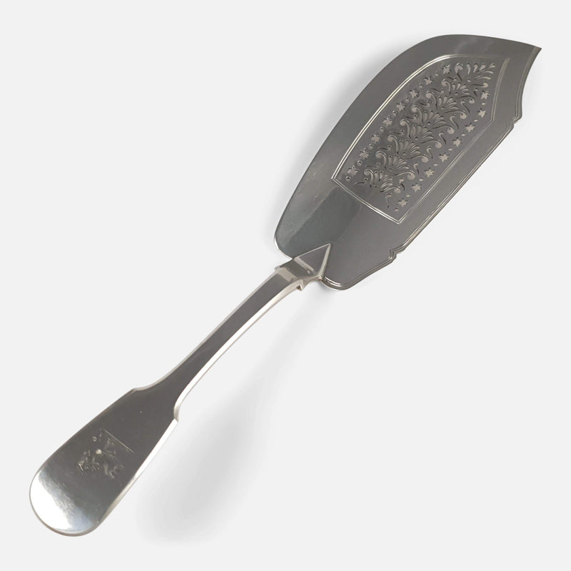 the George IV silver fish slice viewed diagonally