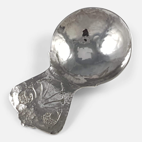 the sterling silver tea caddy spoon by Bernard Instone viewed diagonally
