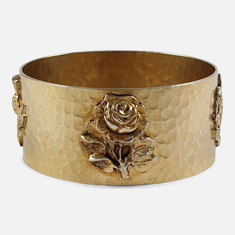 the napkin ring's applied rose decoration