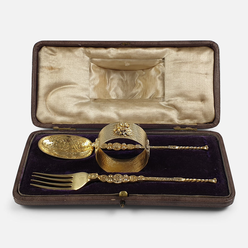 the silver christening set viewed in the case