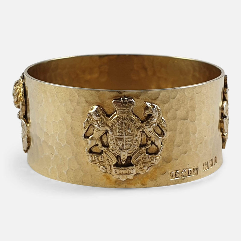 the napkin ring's applied coat of arms decoration