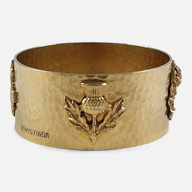 the napkin ring's applied thistle decoration