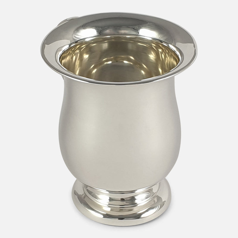 the cup with handle out of view to the rear