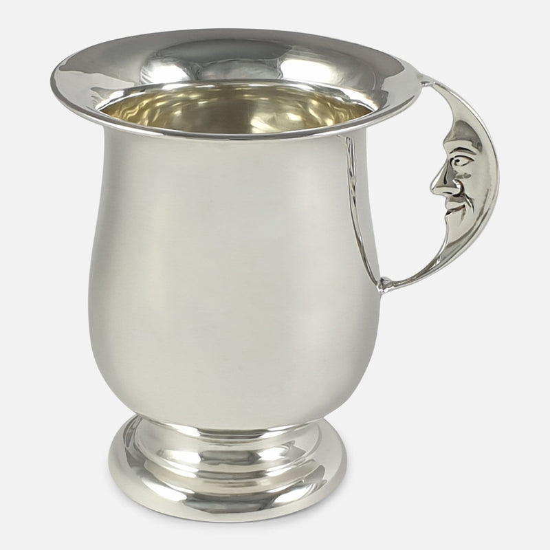 the silver christening cup with the Man in the Moon handle in view