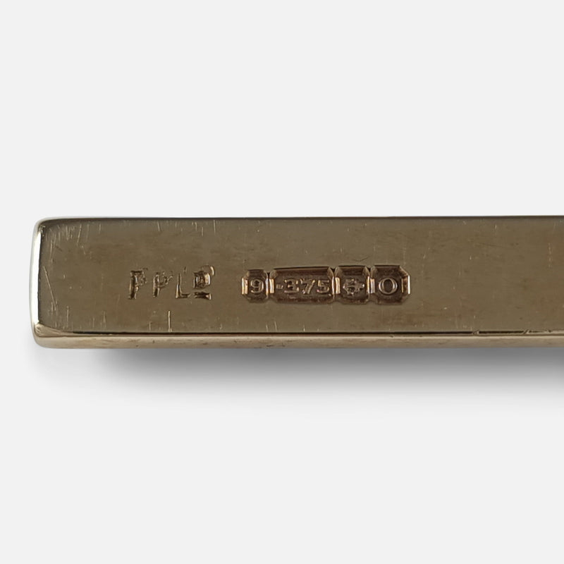 the hallmarks and makers marks to the back of the cross pendant