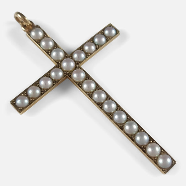 the Art deco period 9ct yellow gold seed pearl cross pendant viewed diagonally