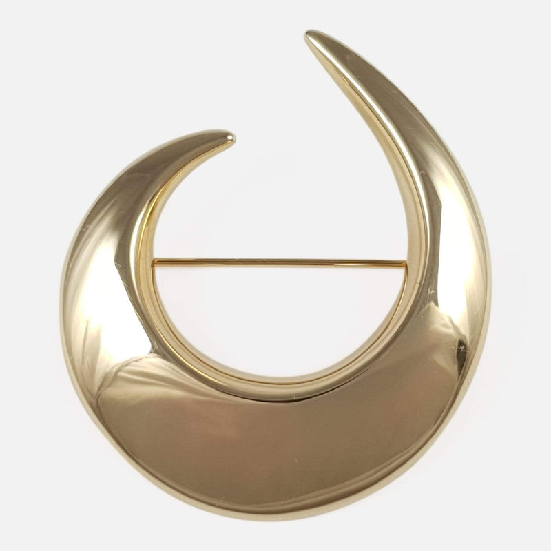 the 14ct yellow gold crescent brooch viewed from the front