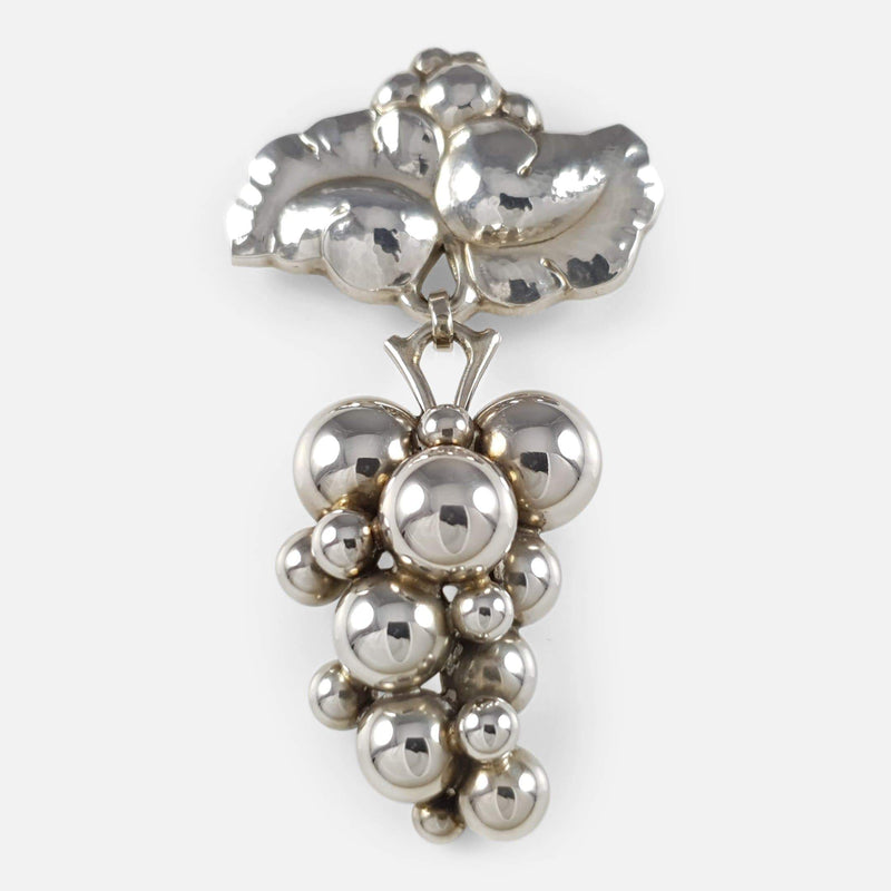 the Georg Jensen silver moonlight grapes brooch viewed as it would be worn