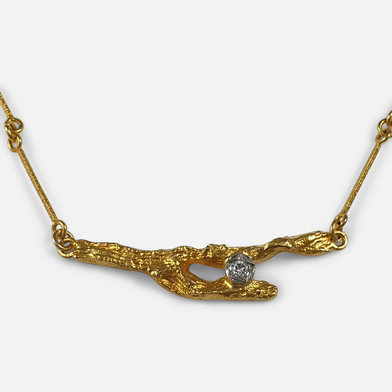 focused on the 18ct Gold and diamond pendant section of the Lapponia necklace