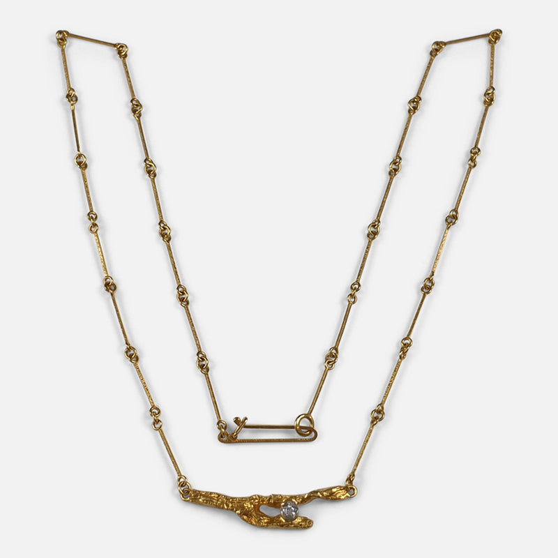 a view of the diamond necklace from the front
