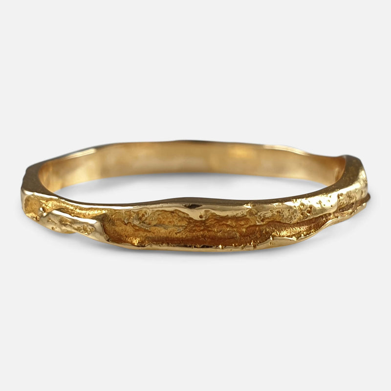 the gold band viewed from the front