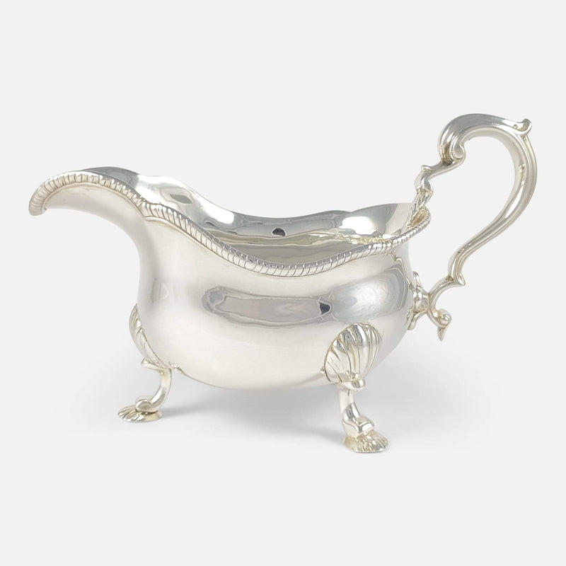 one of the sterling silver sauce boats viewed side on
