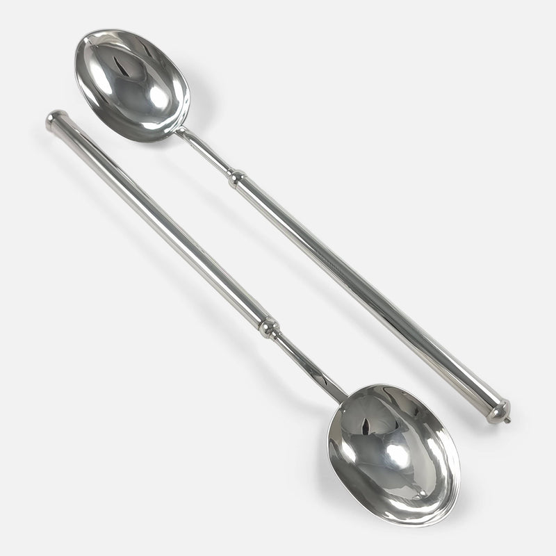 the silver serving spoons viewed diagonally