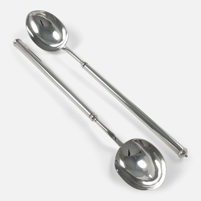 the serving spoons facing in opposite directions and viewed diagonally