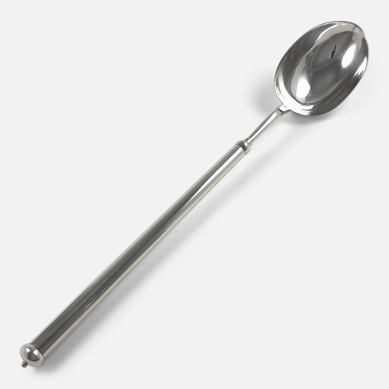 focused on one of the serving spoons viewed diagonally