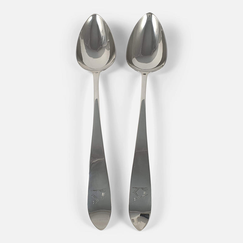 the pair of silver spoons viewed vertically