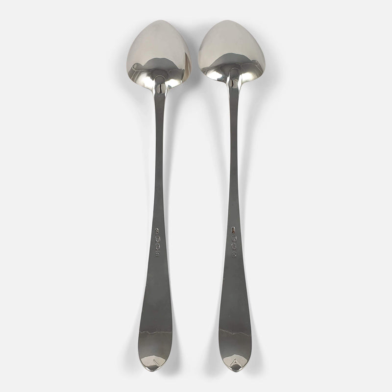 the pair of spoons lying face down to view the backs