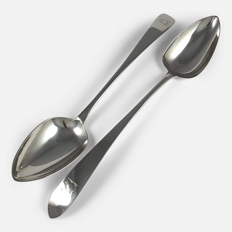 the serving spoons viewed diagonally facing in opposite directions to one another