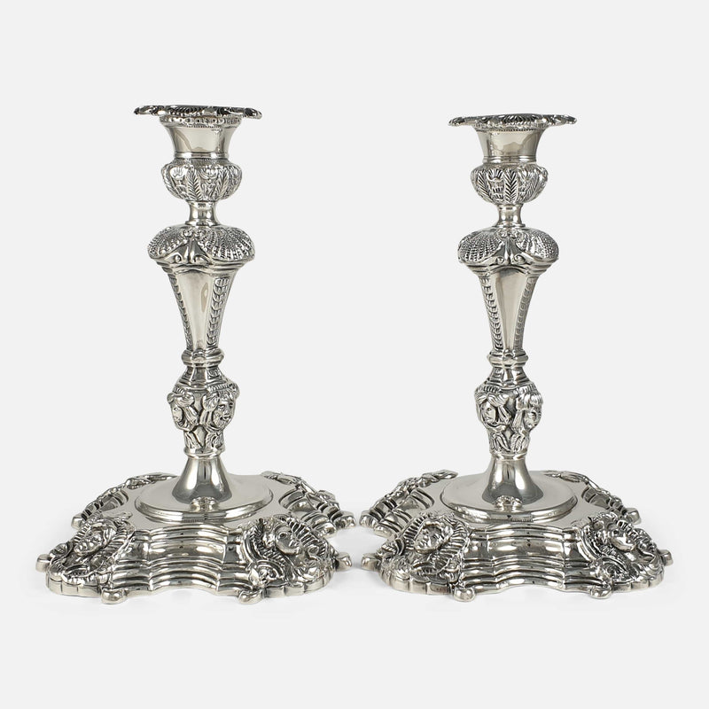 the pair of sterling silver candlesticks viewed from the front