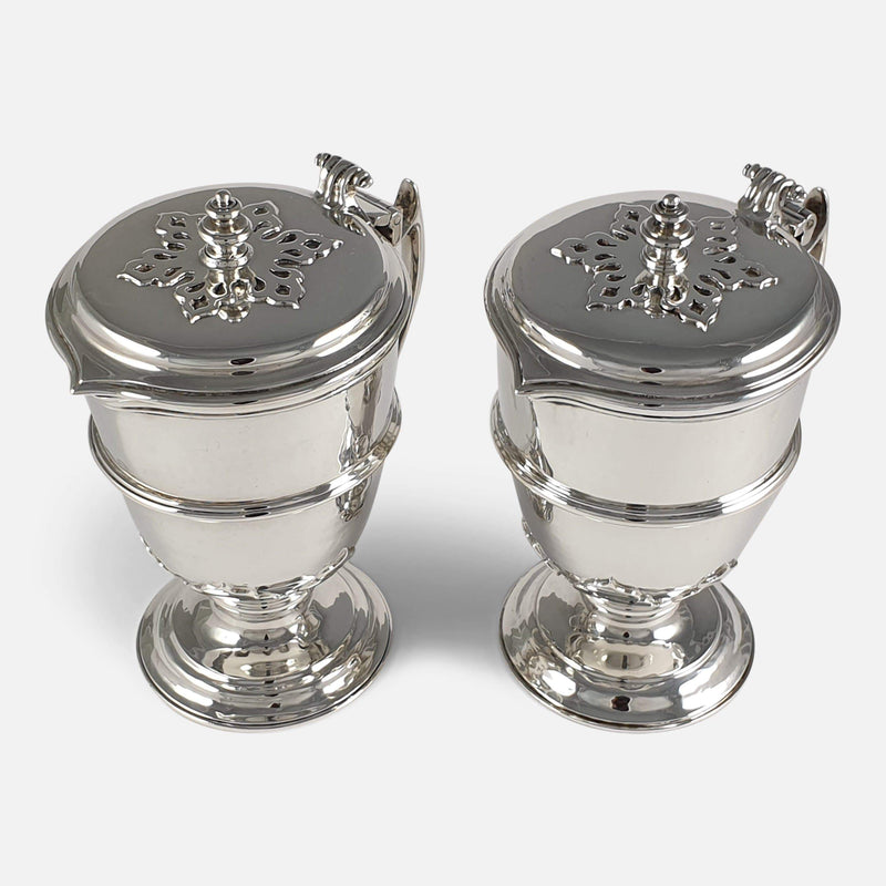 the pair of silver jugs viewed from a raised position