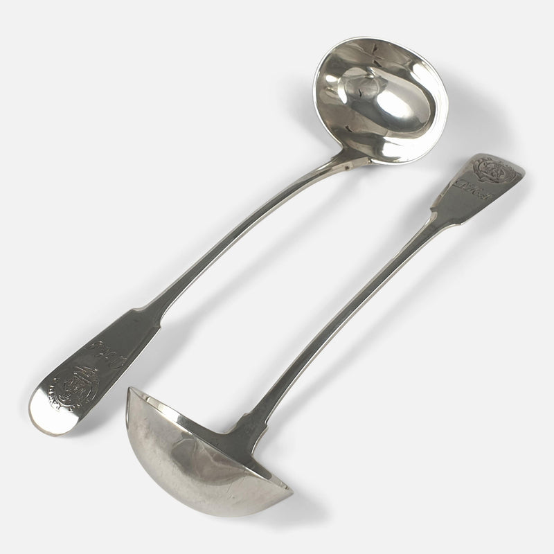 the toddy ladles viewed facing in opposite directions to one another