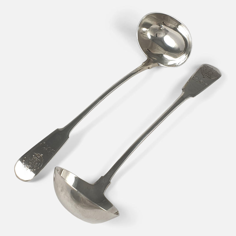 the toddy ladles viewed diagonally facing in opposite directions