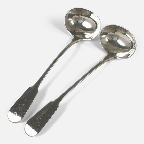 The pair of Georgian silver toddy ladles viewed diagonally