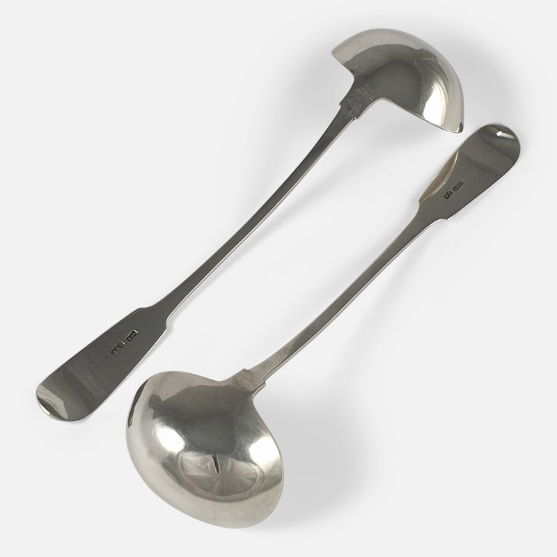 the toddy ladles lying face down in opposite directions to one another