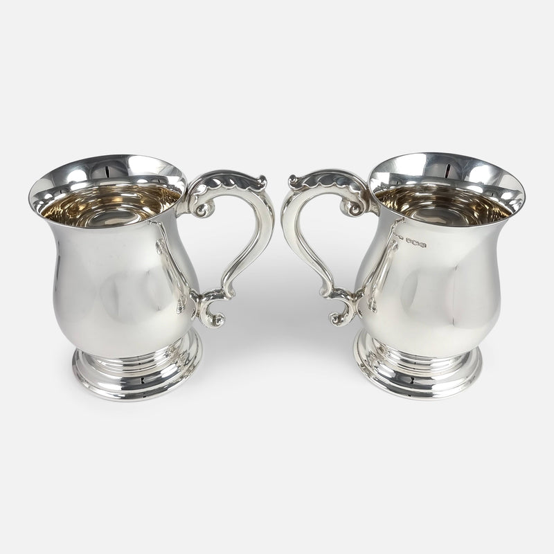 the mugs side on with handles pointing to one another