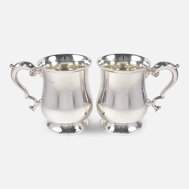 the pair of mugs viewed side on with handles facing in opposite directions