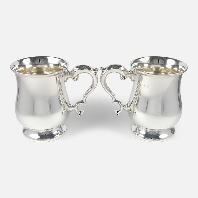 a view of the pair of mugs with handles facing each other