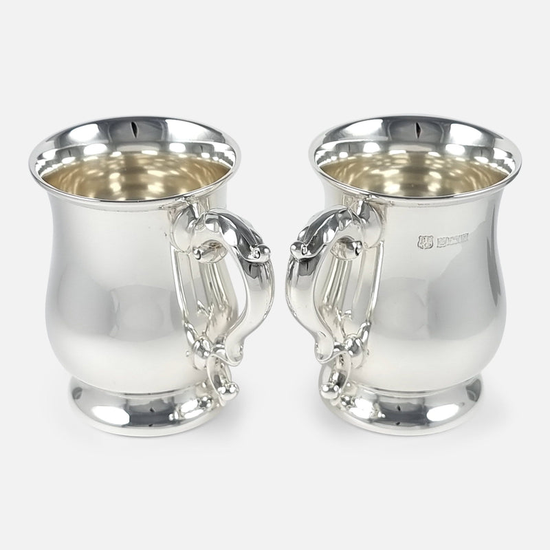 the pair of mugs with handles to forefront pointing slightly towards each other