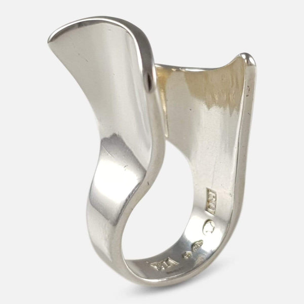 The silver abstract ring viewed upright at an angle